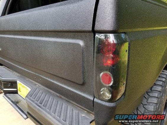 The tailgate has the typical dent from the swingaway, so all the holes must have been filled before the bedliner was applied.

[url=https://www.supermotors.net/registry/media/894887][img]https://www.supermotors.net/getfile/894887/thumbnail/swingawaysexploded.jpg[/img][/url] . [url=https://www.supermotors.net/registry/media/895149][img]https://www.supermotors.net/getfile/895149/thumbnail/spareinside.jpg[/img][/url]

Supply & install used original swingaway $550 (includes extract broken bolt & clean body filler from nuts) [url=https://www.supermotors.net/registry/media/1161315][img]https://www.supermotors.net/getfile/1161315/thumbnail/01swawmts.jpg[/img][/url]

Supply & install new black aftermarket LED license lights $40 [url=https://www.supermotors.net/registry/media/1158321][img]https://www.supermotors.net/getfile/1158321/thumbnail/01tailleds.jpg[/img][/url]