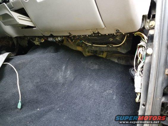 under dash wiring and carpet in a vehicle