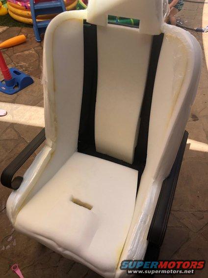 Car seat foam with black seatbelt straps