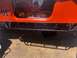 1992 Jeep Wrangler - Interior view of an orange 1992 Jeep Wrangler, custom decals and a drill on the floor.