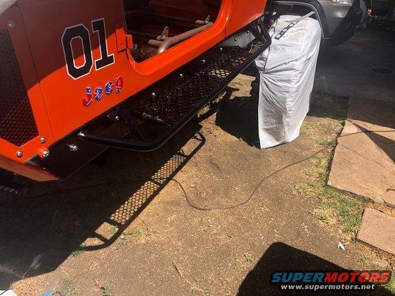 Orange Jeep side view with number 01 and Jeep logo on the door