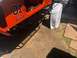1992 Jeep Wrangler - Side view of an orange Jeep with custom graphics and side steps.