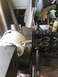 1992 Jeep Wrangler - Machining a white plastic part in a vise, metal shavings are visible on the surface.