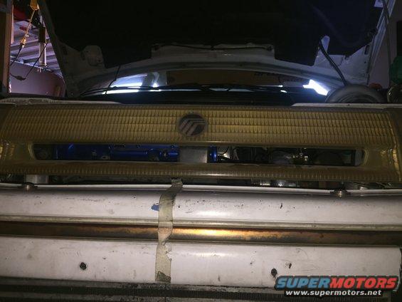 1993 Mercury Tracer grille with a blue component behind it