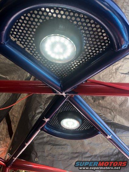 Interior roll cage with blue and red paint, two LED lights