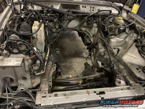 2000 Jeep Cherokee engine bay, engine removed, showing frame and wiring
