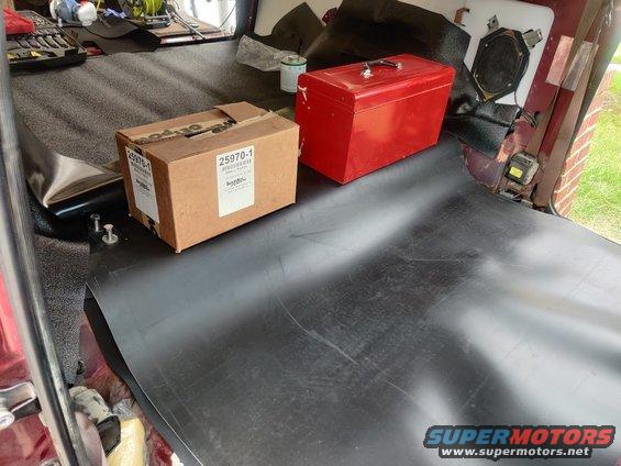 img_20200821_113343.jpg 20200821 - Needed heavy boxes to keep the MLV down on the bit that attached the cargo area to the cabin area while the vinyl cement set.