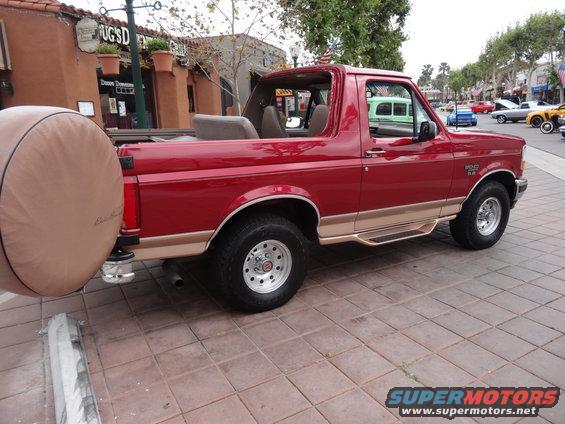 Red 1994 Ford Bronco with removable top and spare tire carrier