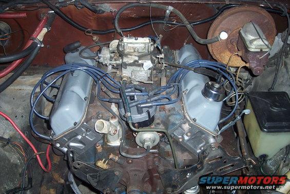 Engine bay with V8 engine, carburetor, distributor, and brake booster