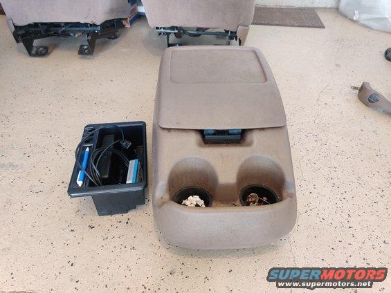 20200901 - Medium mocha center console, in great shape. Comes with cup inserts, coin insert/shelf, and the three bolts to mount it to the floor.