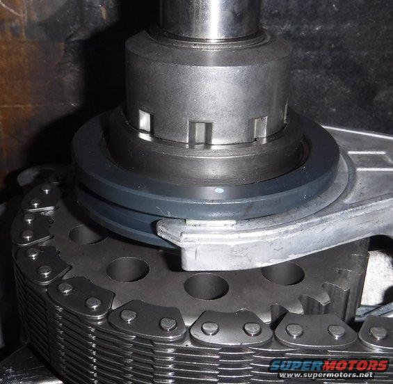 dscf2486--tcase-chain-not-level.jpg Input/rear output shaft is the one sitting too low relative to shift fork, allowing spring-loaded puck to partially engage 4WD lock cog above it.