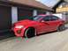 2009 Holden Commodore - A red sedan with aftermarket modifications is viewed from the front three-quarter angle.