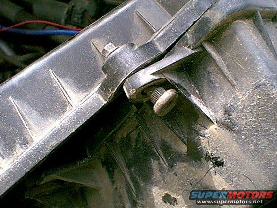 Close-up of a radiator mounting bracket with screws