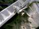 1988 Ford Bronco - This image shows a close-up view of a radiator mounting bracket and its fasteners.