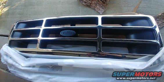 Chrome grille with Ford oval emblem, likely from a 1996 Ford Bronco