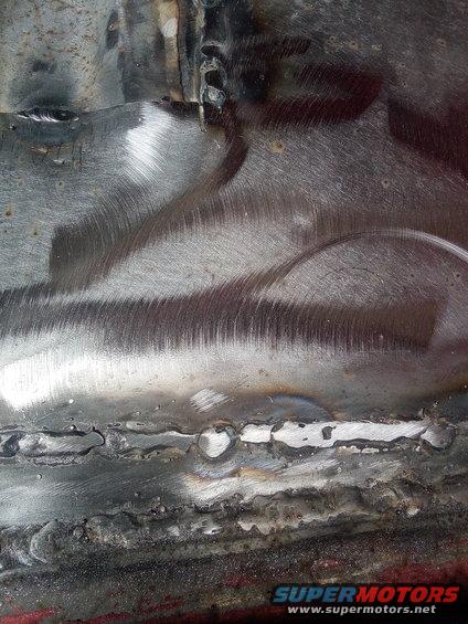 Welded metal with grinding marks and some rust