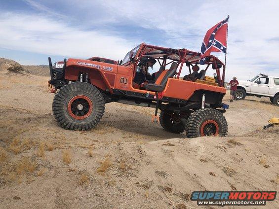 Orange off-road Jeep with "GENERAL LEE" text, number 01, and Confederate flag