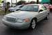 1995 Mercury Grand Marquis - Silver sedan parked in a lot with other vehicles visible in the background.