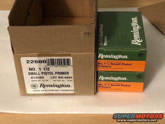 Cardboard box with label '22600 NO. 1 1/2 SMALL PISTOL PRIMER' and stacked boxes of Remington No. 1 1/2 Small Pistol Primers