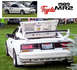 1989 Toyota MR2 - A white 1989 Toyota MR2 is shown from the rear, a prominent spoiler and custom license plate.