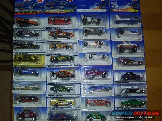 Collection of packaged Hot Wheels toy cars, various models and colors