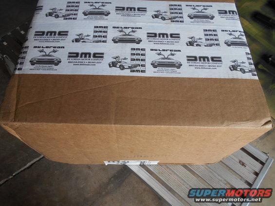 Cardboard box with repeating DeLorean car images and text