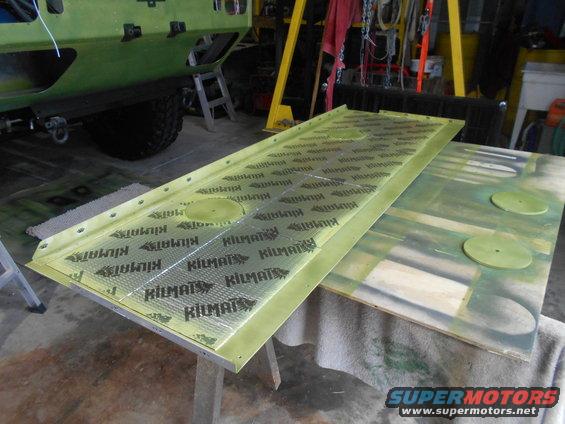 Kilmat sound deadening material applied to a metal panel, with another panel visible to the right
