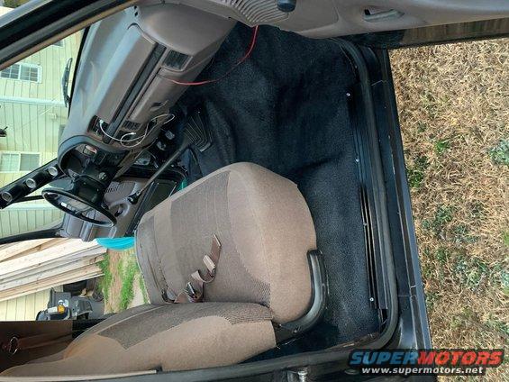 Interior of a 1996 Ford Bronco showing the driver's seat and dashboard