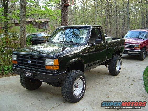 Black 1989 Ford Ranger pickup truck with lifted suspension and off-road tires