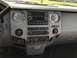 2011 Ford F-250 - The interior of a 2011 Ford F-250 features a gray dashboard with a central infotainment system and climate controls.