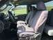2011 Ford F-250 - Interior view of a truck's front seats, showing gray seat covers and the steering wheel.
