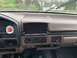 2008 Ford Focus - The interior of a vehicle shows a dashboard with an aftermarket stereo and climate controls.