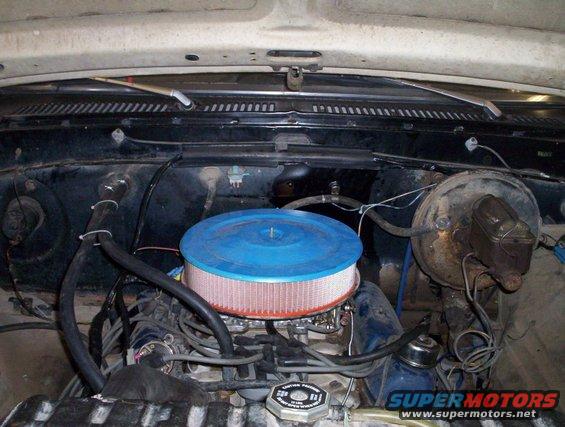 Engine bay with blue air filter and brake booster