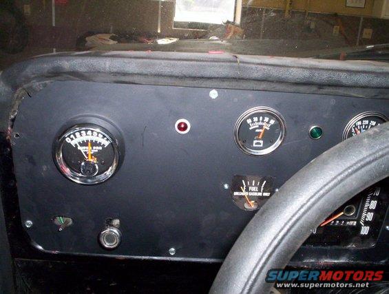 Dashboard with ammeter, fuel gauge, and speedometer. Steering wheel is visible