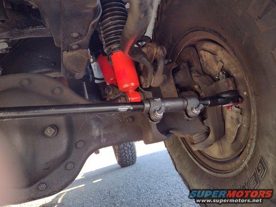 1994 Ford Bronco front suspension with red shocks and steering linkage