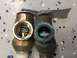 1995 Chevrolet P30 1 Ton - Step Van - Comparison of a new pressure relief valve next to a corroded one, showing wear and tear.