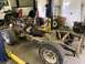 1979 Jeep CJ5 - This 1979 Jeep CJ5 chassis is undergoing work in a garage, with the engine and transmission out.
