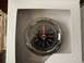 1979 Jeep CJ5 - This is a close-up of a car clock, likely an aftermarket part, with a black face and chrome trim.