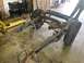 1979 Jeep CJ5 - The chassis of a vehicle is shown, with suspension components and brake lines visible.