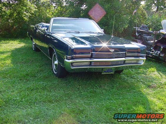 stjustinmartyrcarshow-001.jpg All set up.  I drove the car here with the top down, and kept it down driving home too.  Nice to get a shady spot for a change, even though it was a pretty small show-- maybe 40 or 50 cars at the Italian and American Club in Wickliffe.  Lots of music, food, etc. plus a generous "goody bag."