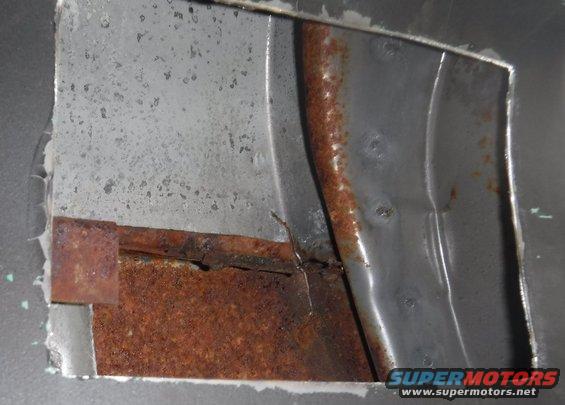B-pillar access hole cut on the passenger side.  Lots of rust hiding in there!