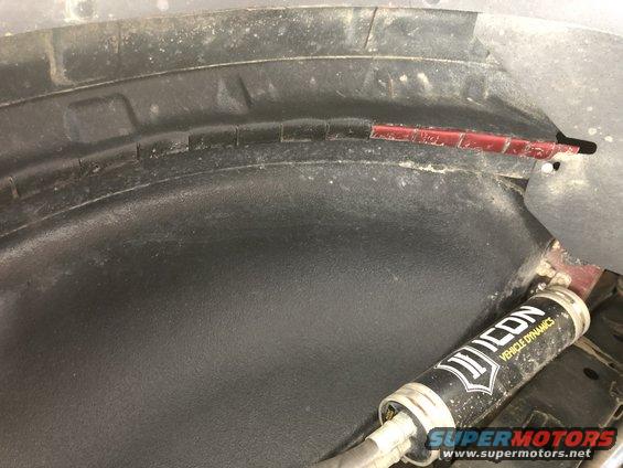 Wheel well liner with Icon Vehicle Dynamics shock absorber visible