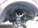 2014 Ford F-150 - Close-up view of the front suspension system, highlighting ICON brand shocks and control arms.