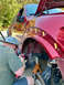 2014 Ford F-150 - Modifying fender flares on a red truck, which appears to be from the 2009-2014 generation.