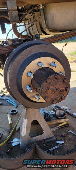 Close-up of a rusty wheel hub and suspension components