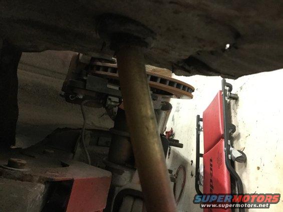 9edcecd7434f4a11b868aed243ca37ba.jpeg Rear looking forward to D0ZX brake set up.  There is a bracket bolted to the axle flange.