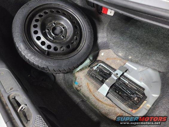 The spare was nearly flat, so it will need to be checked & aired up frequently. The original jack is stowed, but the original lug wrench was missing, so a similar replacement has been stowed. The extra jack has been removed.