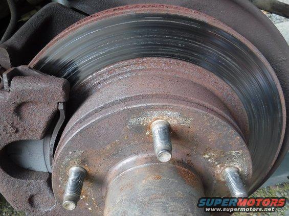 dscf3702--pass-rotor-heavily-scored.jpg Pulled the passenger side wheel to try out the EBC brake pads, only to discover a heavily scored rotor.  (The driver's side is fine; I could have spotted the damage through the wheel holes.)  No sign of debris stuck in the pad or caliper.