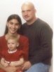 Family portrait with two adults and a young child