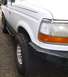 1992 Ford Bronco - New 15x10 wheels, Pro Comp 69 / 1069, front angled view.